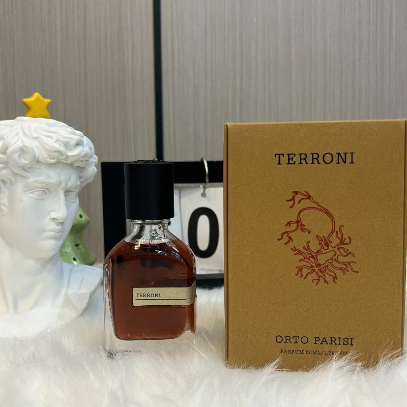 Unisex Oriental Woody perfume by Blushimmer, 50ml bottle with warm amber, soft musk, and earthy notes in an elegant fragrance.