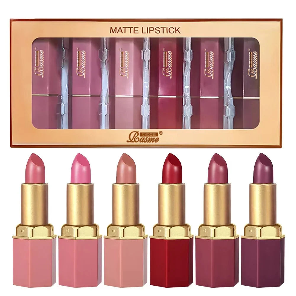 Six Blushimmer velvet lipstick tubes in gold, featuring matte, pearlescent glitter textures in six different colors for Valentine's Day.