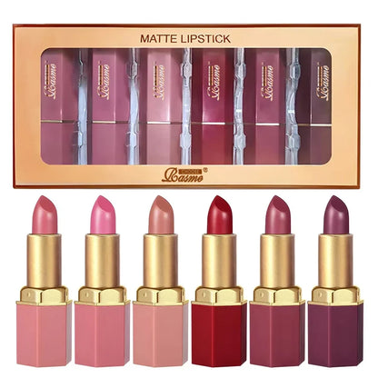 Six Blushimmer velvet lipstick tubes in gold, featuring matte, pearlescent glitter textures in six different colors for Valentine's Day.