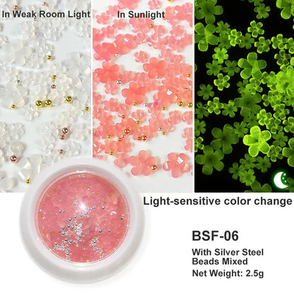 White acrylic flower nail art decorations with mixed size rhinestones and colorful gems for DIY manicure designs.