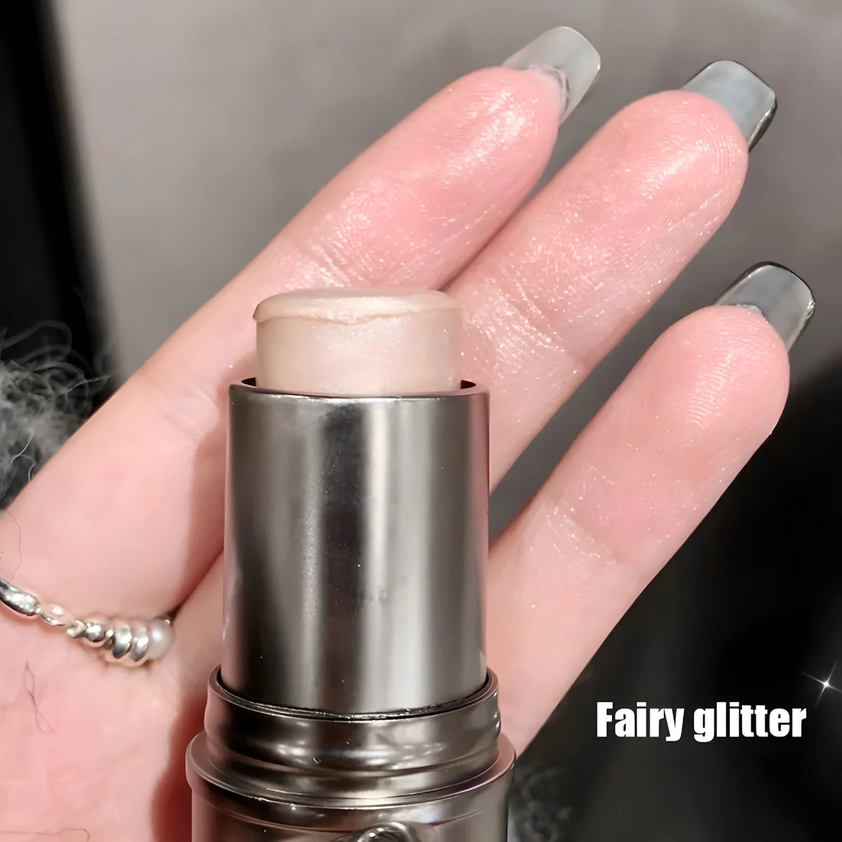 Blushimmer highlighter stick with pearlescent finish brightens and contours eyes, creating a natural, luminous glow.