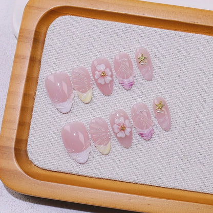 Set of 10 Blushimmer French almond press-on nails with floral design, wearable false nails for easy application and natural look.