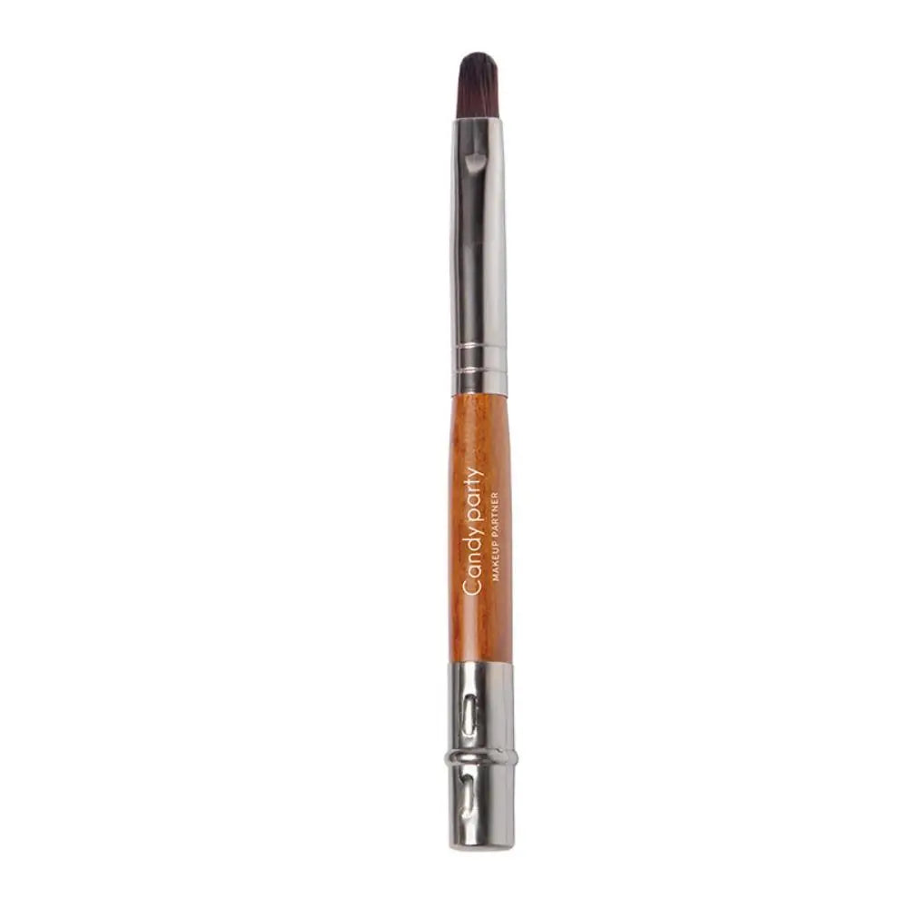 Blushimmer portable gold and silver lips makeup brush pen with metal handle, protective cap, for applying lipstick and lip gloss.