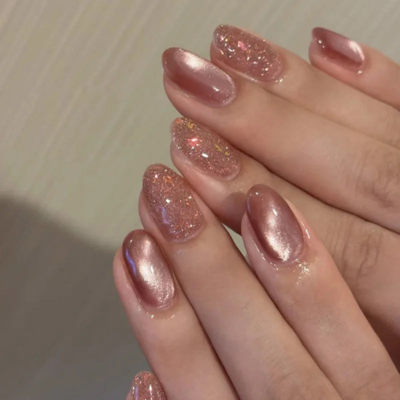 Set of 24 glossy red cat's eye press-on nails by Blushimmer, nude almond shape with detachable charms for stylish wear.