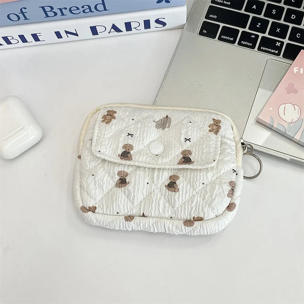 Blushimmer cute cartoon small travel cosmetic bag with lipstick, earphone, and card storage, ideal for makeup and accessories.