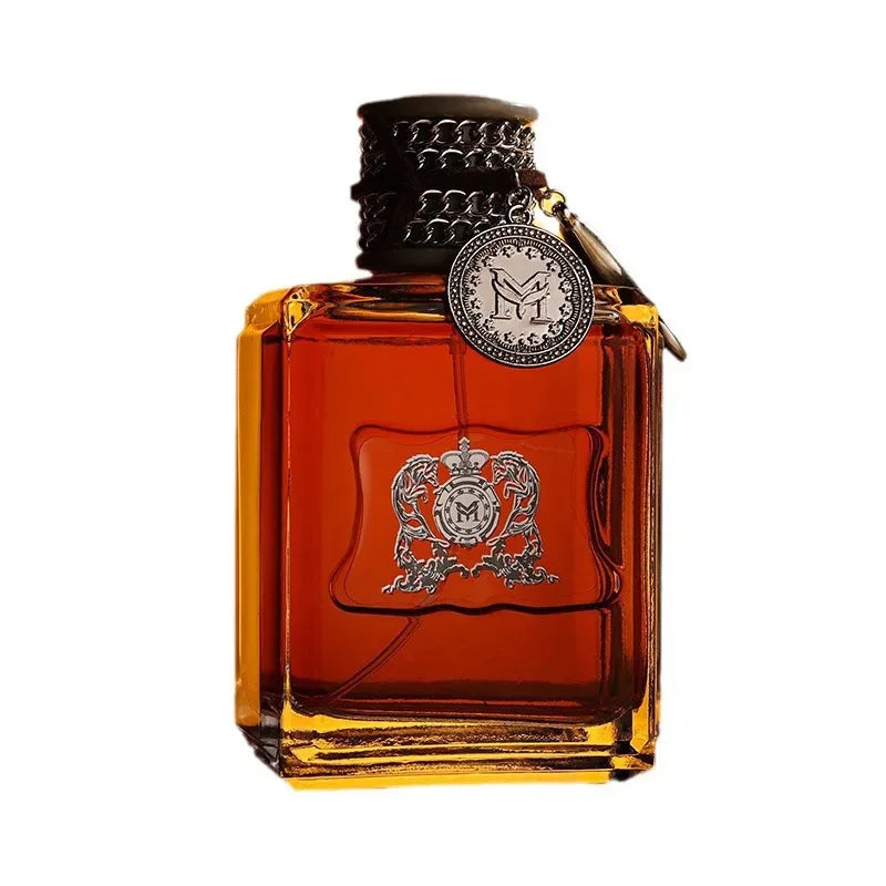 Blushimmer Charm Unleashed cologne bottle featuring woody, citrus, and vitality notes for men with a bold, glamorous scent.