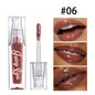 Hydrating Crystal Lip Oil by Blushimmer, tinted plumping and moisturizing gloss with a clear, glossy finish on smooth lips.