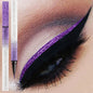 Shiny pearlescent metallic liquid eyeliner by Blushimmer, waterproof formula, 0.6ml, featuring a sleek applicator and shimmering finish.