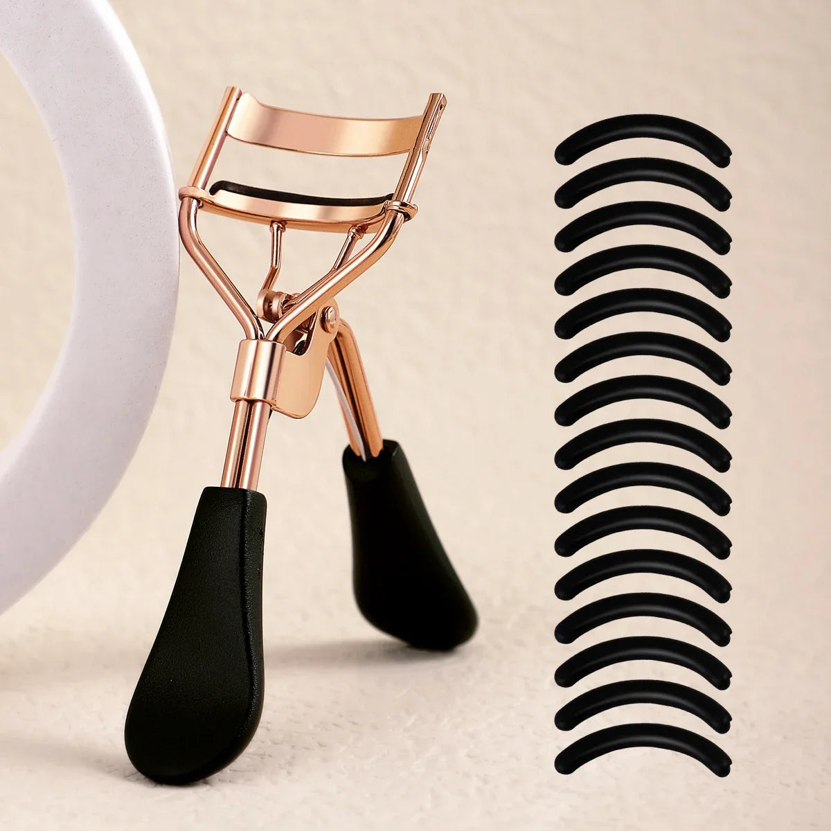 Blushimmer portable eyelash curler with stainless steel design and 15 silicone pads for eyelash extension and curling.