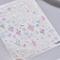 Colorful Cat's Eye 5D gradient European love heart gem nail art stickers with wing and geometric designs for manicure decoration.