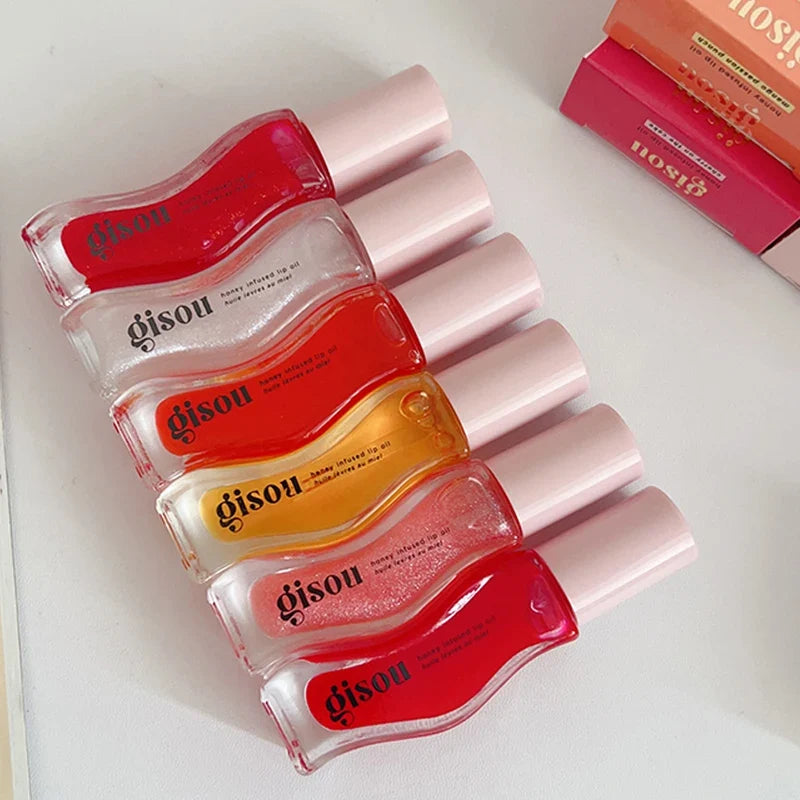 Blushimmer Gisou moisturizing lip balm and gloss with lip plumping and exfoliating benefits, displayed in a sleek tube.