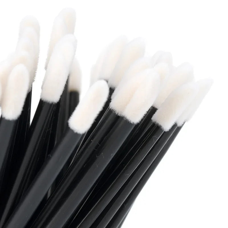 Set of 100 colorful Blushimmer lip brushes and eyelash extension applicator wands for makeup and cosmetic application.