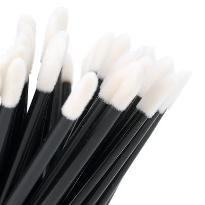 Set of 100 colorful Blushimmer lip brushes and eyelash extension applicator wands for makeup and cosmetic application.