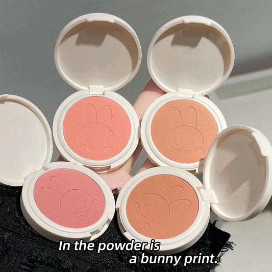 Blushimmer monochrome blush palette with matte peach and rose shades, featuring a cute bunny design for natural cheek contouring.