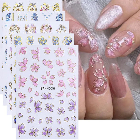 Set of 5 metallic gold line flower nail stickers with 3D border petals and sakura leaf designs for elegant DIY manicure decoration.
