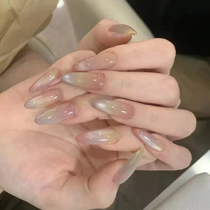 Set of 24 glossy red Cat's Eye press-on nails by Blushimmer featuring nude almond-shaped full cover false nails with charms.