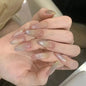 Set of 24 glossy red Cat's Eye press-on nails by Blushimmer featuring nude almond-shaped full cover false nails with charms.