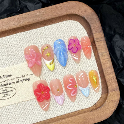 Set of 10 French almond press-on false nails by Blushimmer with floral design, easy-to-wear, reusable fake nails for women.