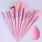 Set of Blushimmer professional makeup brushes including foundation, powder, eyeshadow, and kabuki brushes with soft, fluffy bristles.