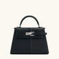 Black OBA women's crossbody handbag with sleek satchel style, featuring a compact design and adjustable strap.