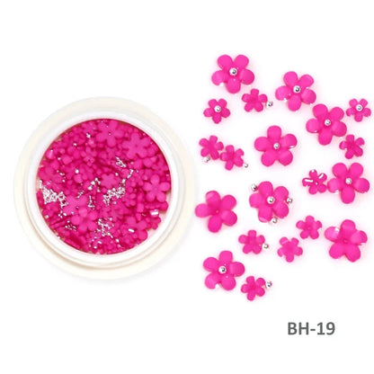 White acrylic flower nail art decorations with mixed size red and blue rhinestones for DIY manicure design, by Blushimmer.