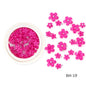 White acrylic flower nail art decorations with mixed size red and blue rhinestones for DIY manicure design, by Blushimmer.