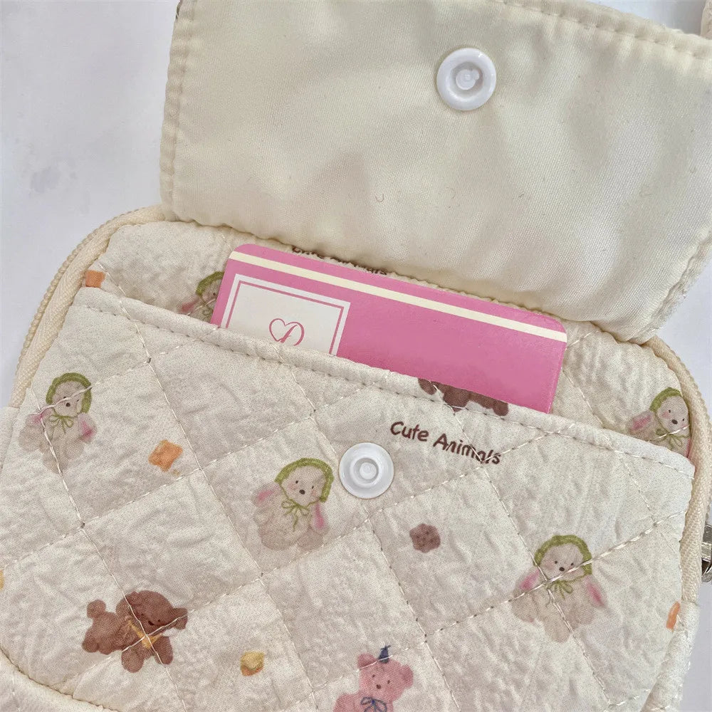 Blushimmer cartoon small travel cosmetic bag with lipstick, earphone, and card compartments, portable makeup organizer for women.