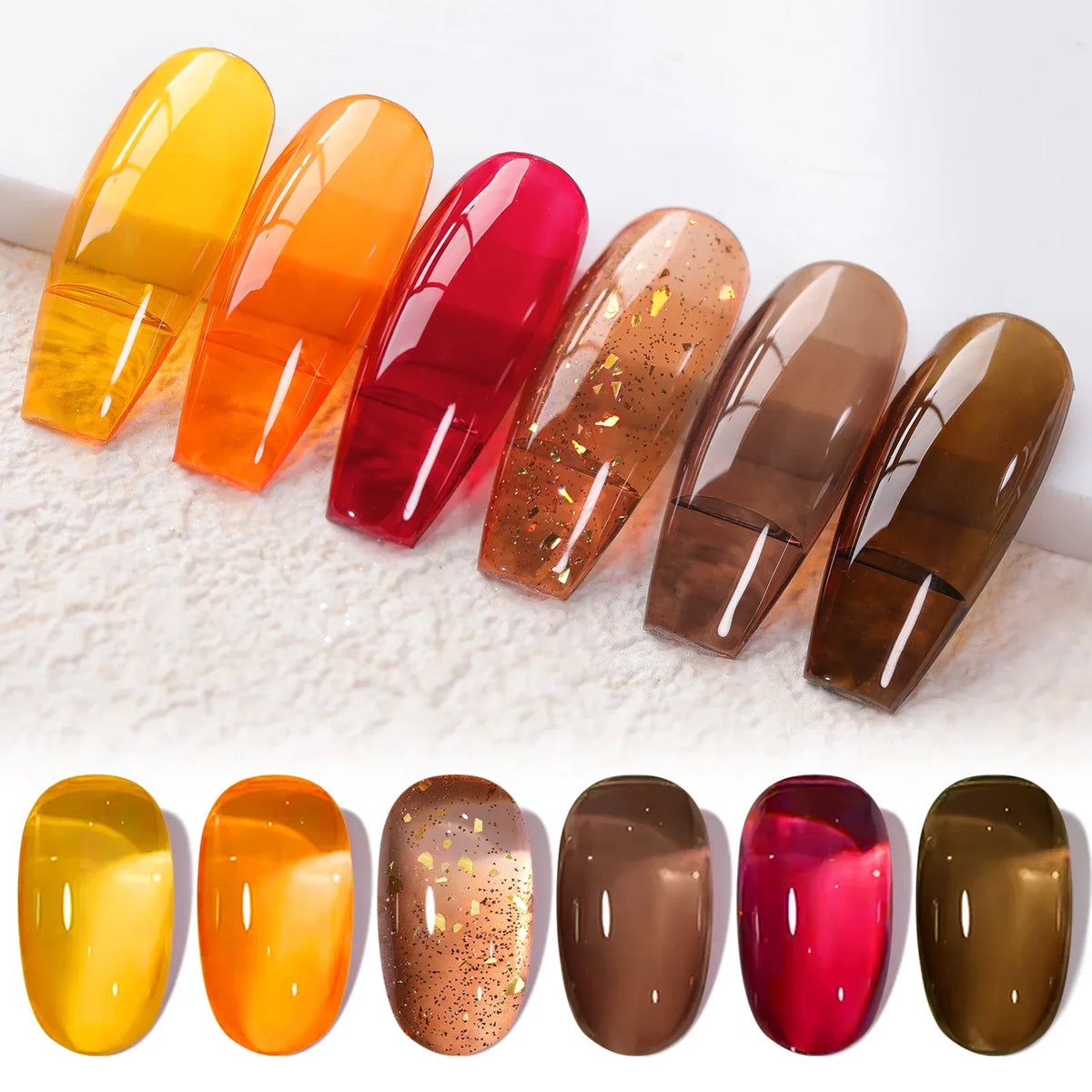 Six bottles of Blushimmer Born Pretty crystal amber gel nail polish set in pink and nude shades for gel manicures.