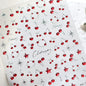 Close-up of Blushimmer cherry-shaped 5D nail art stickers with shiny rhinestones and bowknot design on a manicured nail.