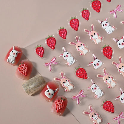Close-up of Blushimmer 5D panda nail stickers with cartoon rabbits, flowers, and animals on a clear background for nail art decoration.