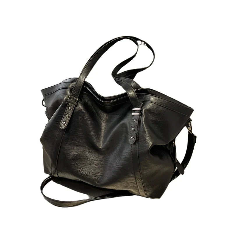Black leather women's tote shoulder crossbody bag by OBA, stylish shopper handbag with smooth finish and versatile design.