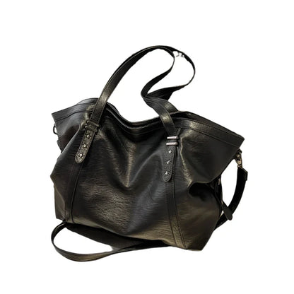 Black leather women's tote shoulder crossbody bag by OBA, stylish shopper handbag with smooth finish and versatile design.