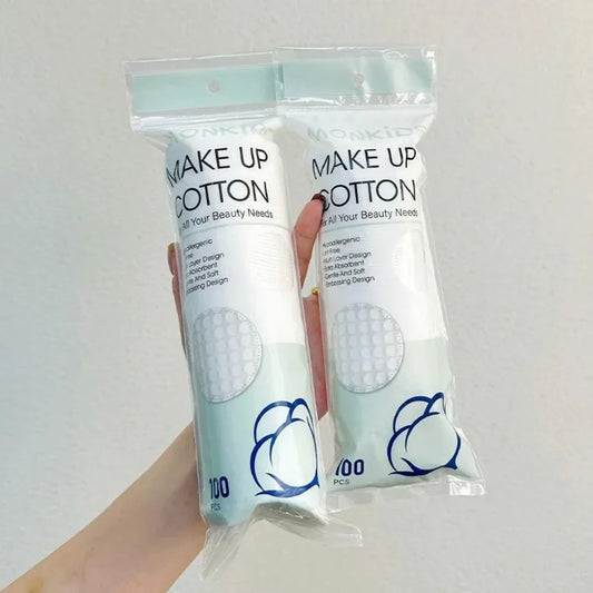 Set of 100/200 soft round cotton pads by Blushimmer, double-sided textured for facial cleaning and makeup removal.