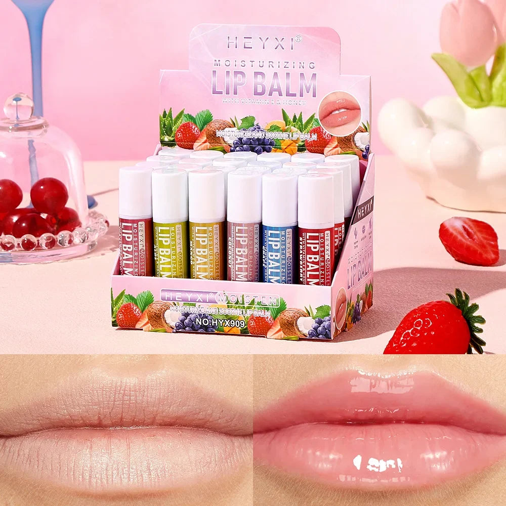 Set of 24 Blushimmer fruit-flavored lip balms with natural moisturizing and hydrating properties for soft, non-sticky winter lips.