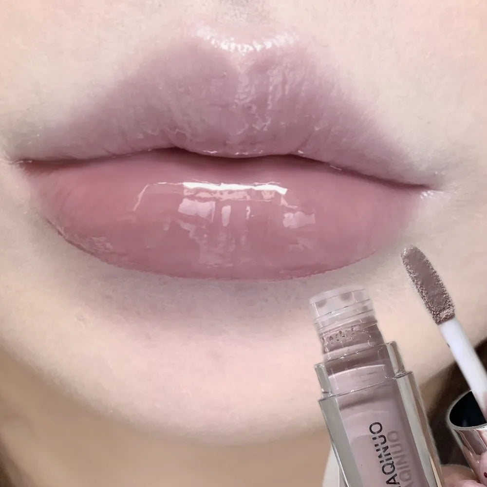 Black Rabbit Gothic silver metallic lip gloss by Blushimmer showcasing a glossy, translucent black water gloss on lips.