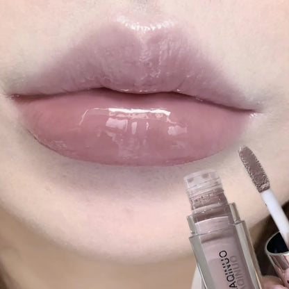 Black Rabbit Gothic silver metallic lip gloss by Blushimmer showcasing a glossy, translucent black water gloss on lips.