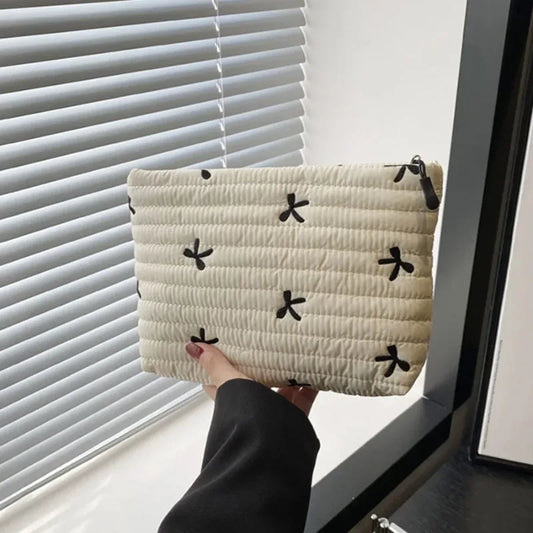 Large capacity Blushimmer makeup bag with zipper, embroidered bow design, ideal for storing cosmetics and toiletries.
