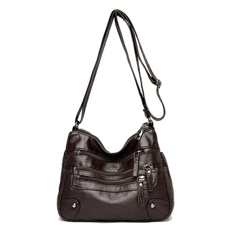 Dark brown women's multi-layer leather shoulder crossbody bag by OBA, showing its multi-pocket design and adjustable strap.