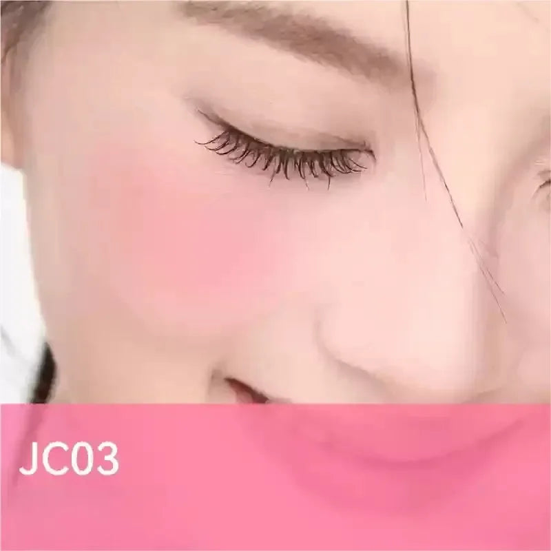 Blushimmer AZTK liquid blush in purple, with a matte finish, brightening and lifting the complexion on a woman's cheek.