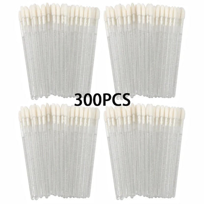 Set of 100/300 clear crystal lip brushes and applicator wands for lipstick and gloss application in makeup and eyelash extension kits