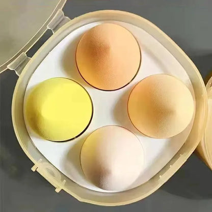 Set of four Blushimmer beauty egg makeup sponges with egg box for foundation, face cream, and powder application.
