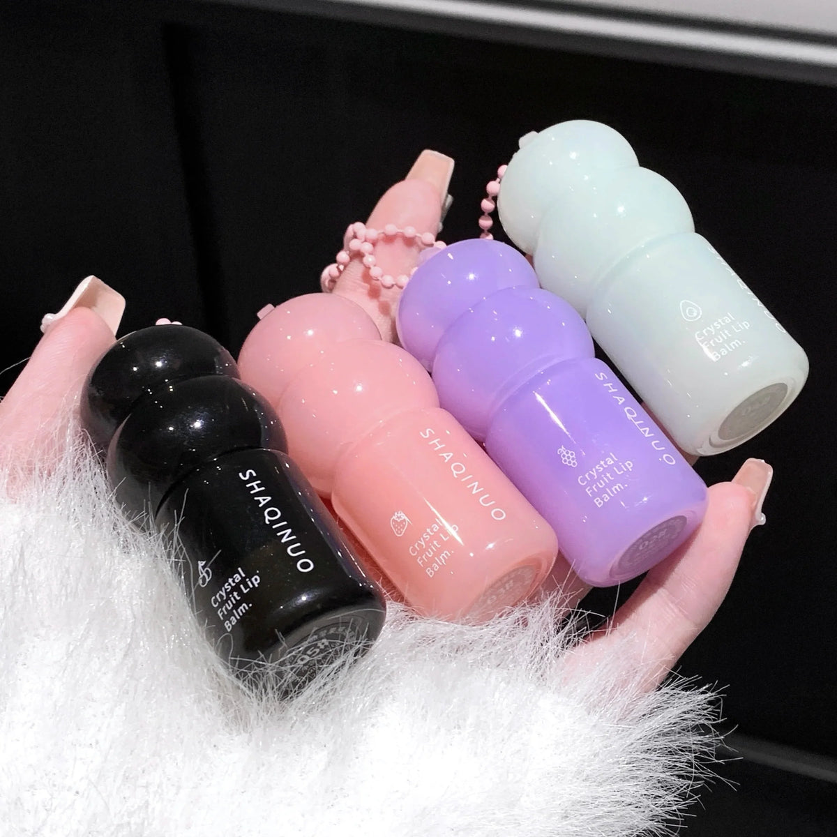Blushimmer hydrating fruit lip balm pendant with tinted moisturizing formula, featuring refreshing fruit flavor for dry, chapped lips.
