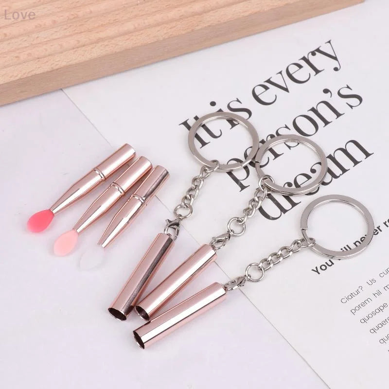 Blushimmer multifunctional silicone lip brush with cover and keychain, ideal for lipstick, eyeshadow, and makeup application.