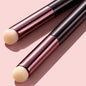 Blushimmer lip brush concealer and lipstick applicator with a slender, multifunctional design for precise lip makeup application.