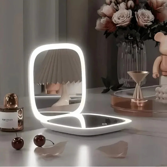 Blushimmer portable LED travel makeup mirror with 2X magnification, three-level dimming, double-sided, handheld, compact, and folding.