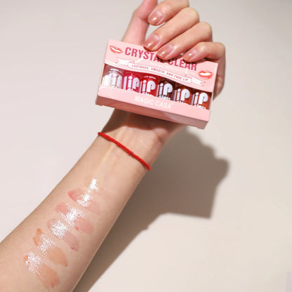 Blushimmer MAGIC CASA 6-pack small hydrating lip oil bottles with shimmering, moisturizing liquid for smooth, long-lasting shine.