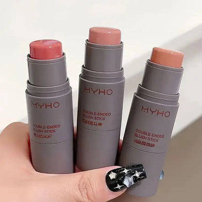 Blushimmer double head sponge powder blusher stick with natural matte finish for lips and cheeks, in a sleek monochrome design.