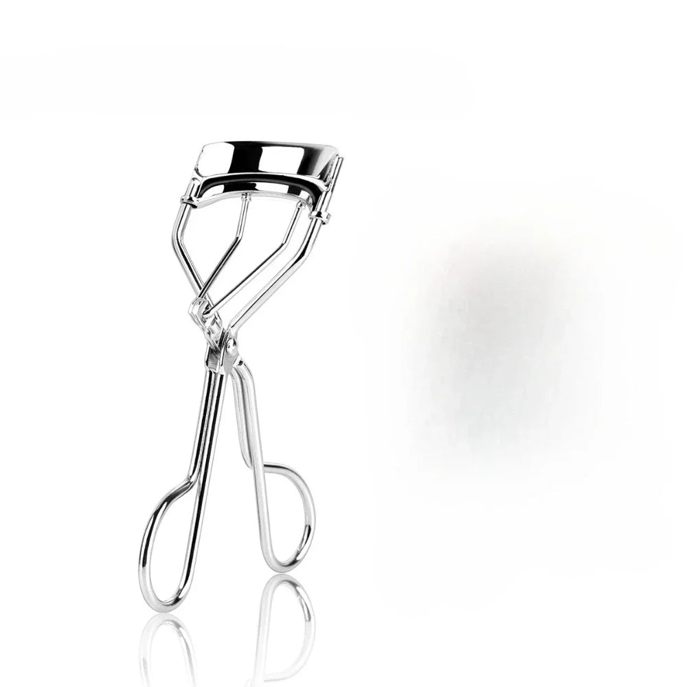 Silver portable curling eyelash tool by Blushimmer for natural, long-lasting, and gentle false eyelash curling and beauty enhancement.