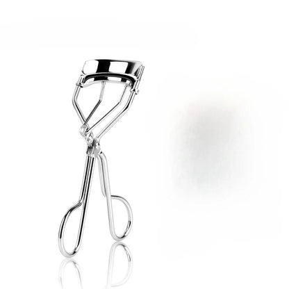 Silver portable curling eyelash tool by Blushimmer for natural, long-lasting, and gentle false eyelash curling and beauty enhancement.