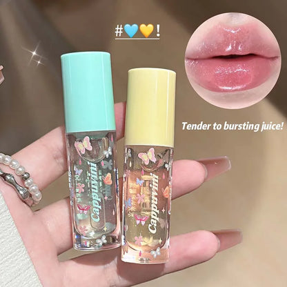 Blushimmer moisturizing shimmer lip gloss with hydrating jelly texture and mirror-like glaze, showcasing a glossy, shimmering finish.